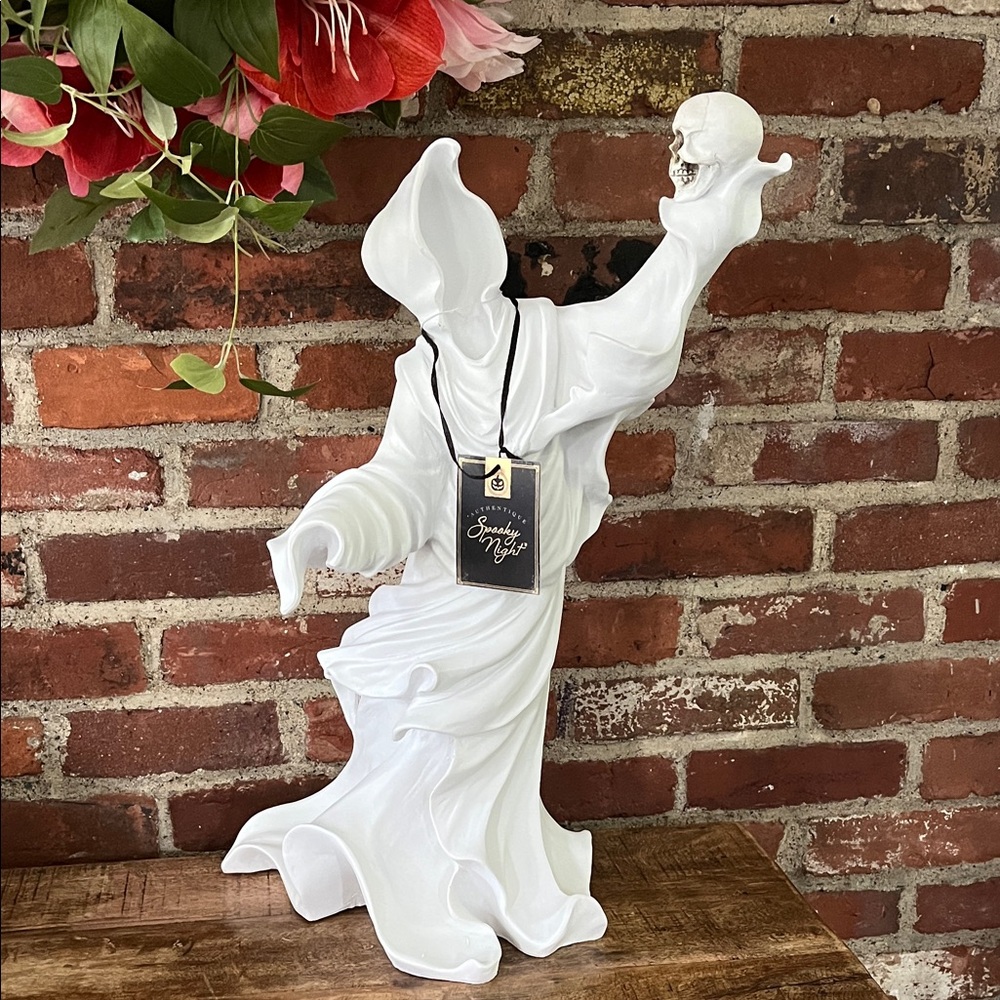 White Ghostly Figurine with Skull